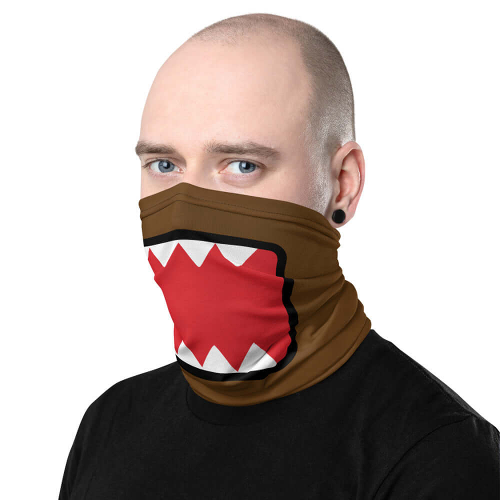 Adult male wearing "DOMO KUN" neck gaiter facing right