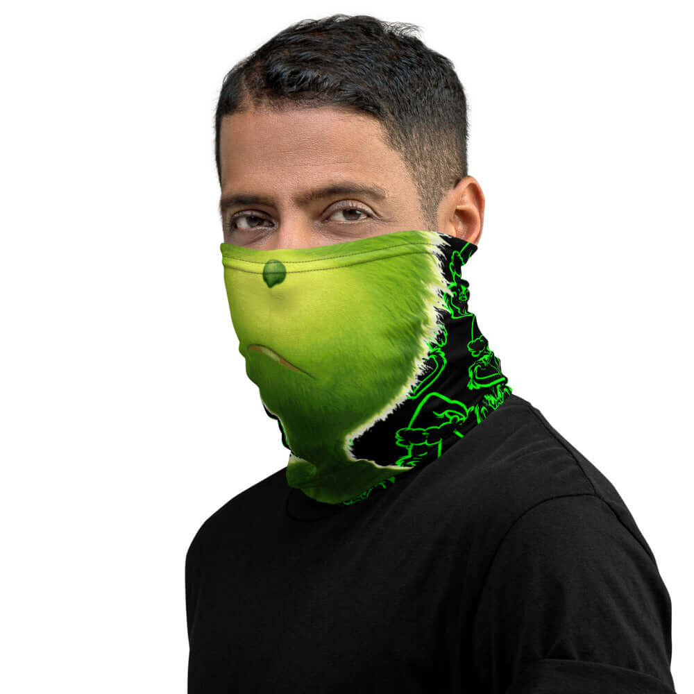 Man wearing "Da Grinch" neck gaiter looking right