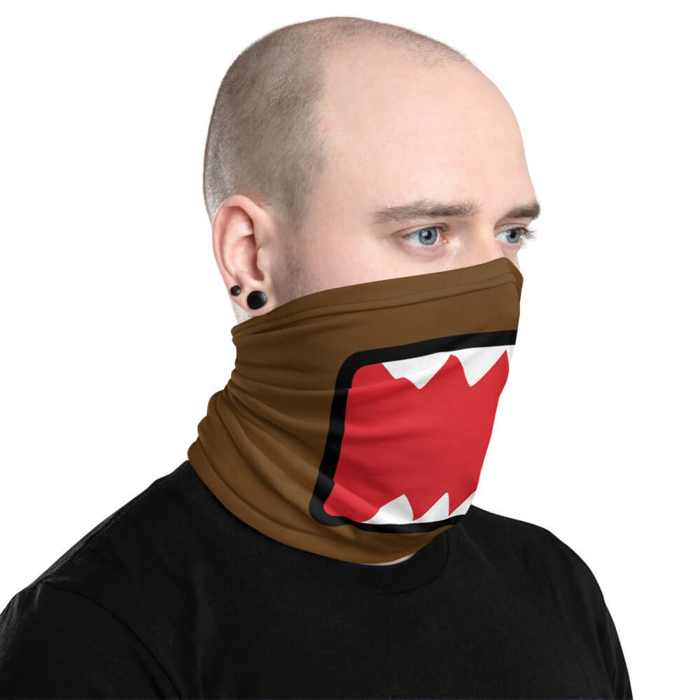 Adult male wearing "DOMO KUN" neck gaiter facing left