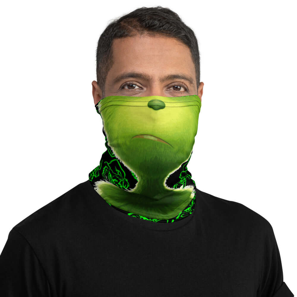 Man wearing "Da Grinch" neck gaiter looking straight