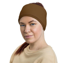 Adult female wearing "DOMO KUN" neck gaiter as a headband