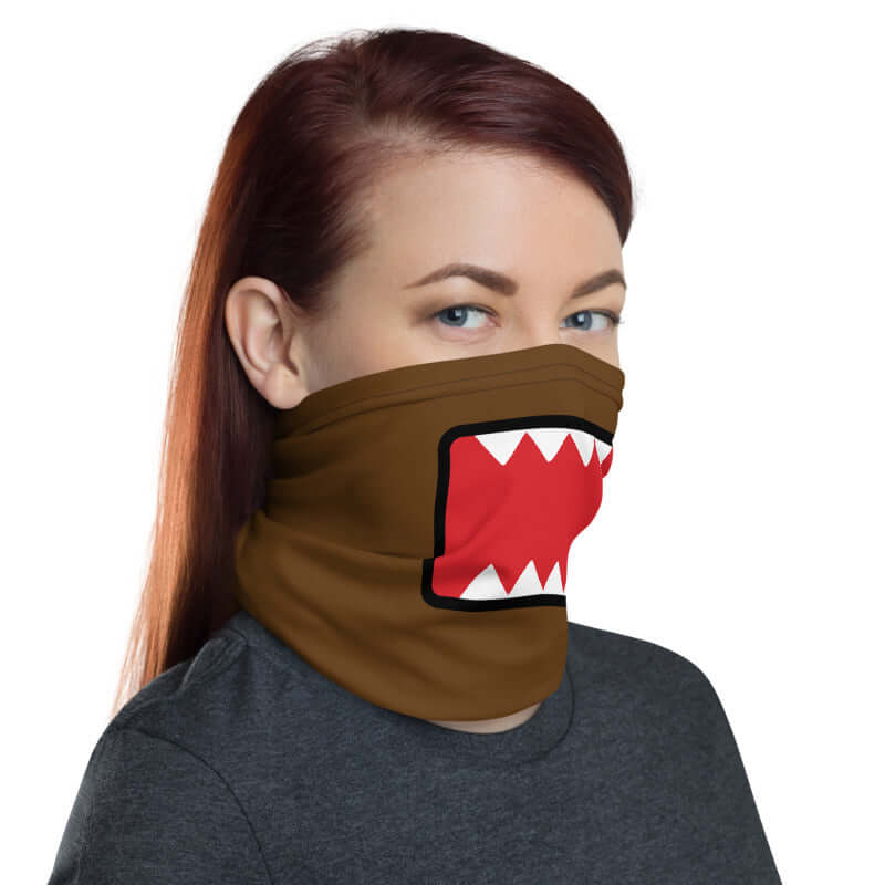 Adult female wearing "DOMO KUN" neck gaiter facing left